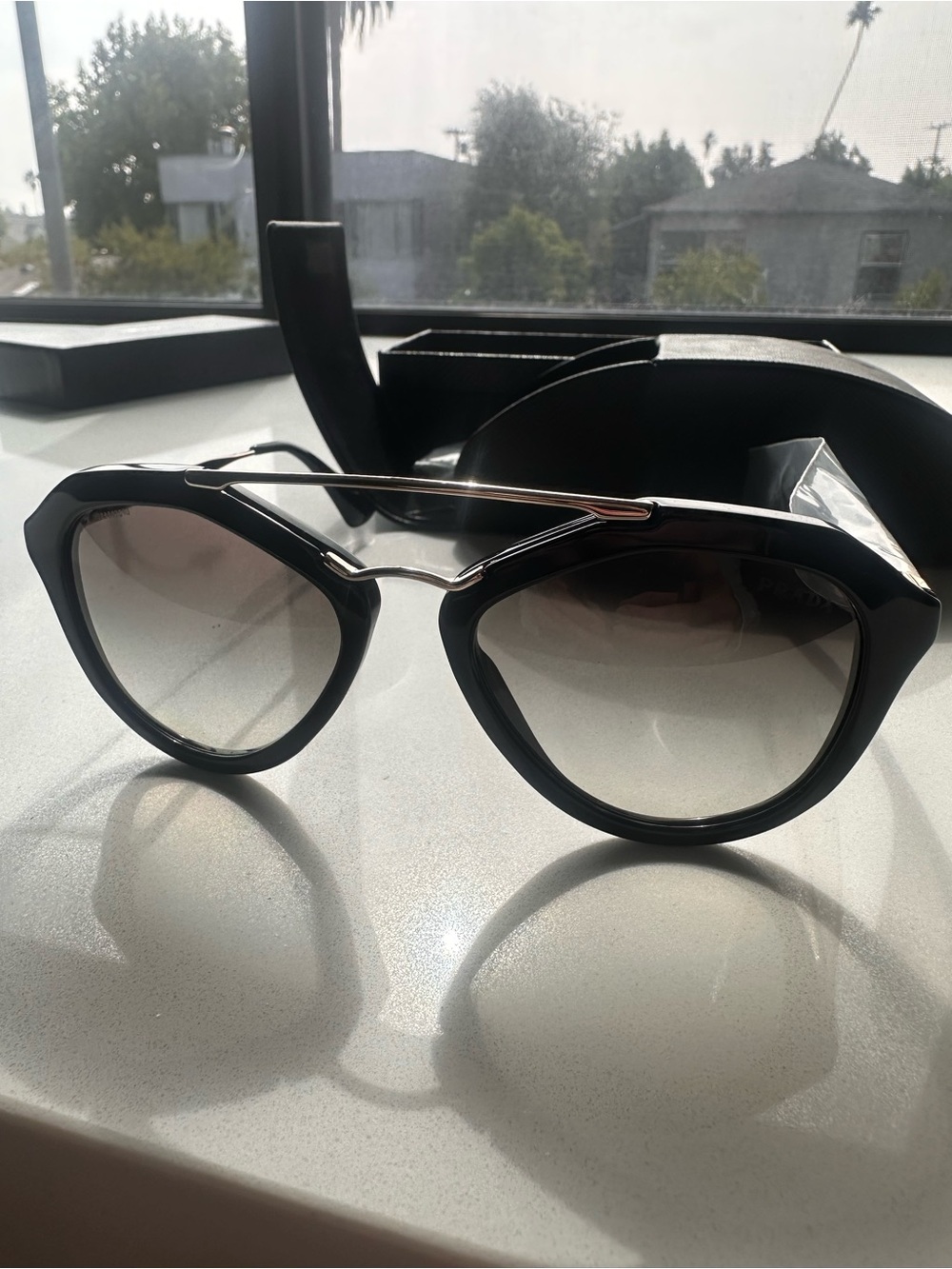 Prada Black Aviator Sunglasses with Gradient Lenses